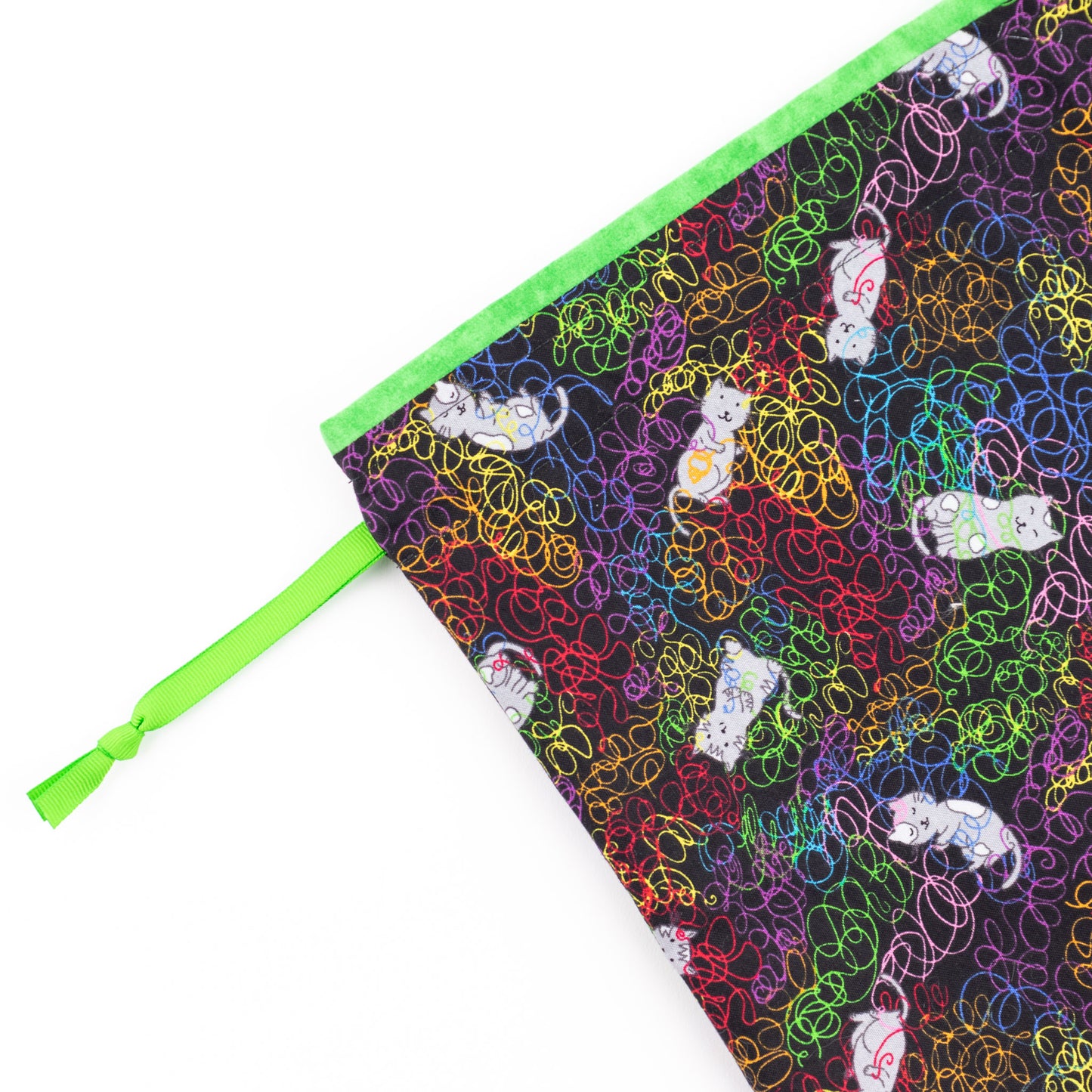 Close up of an XL fabric shoe bag for dance shoes and dance boots from fabric showing cute cats tangled in colorful yarn