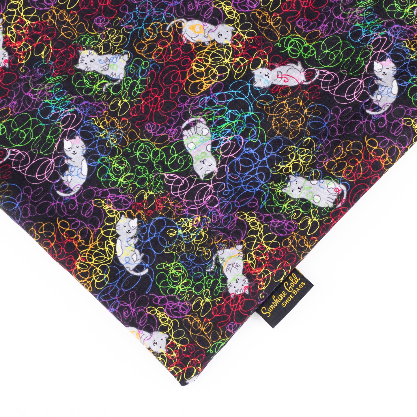 Close up of cats and yarn themed fabric shoe bag in XL size for men's dance shoes or women's dance boots