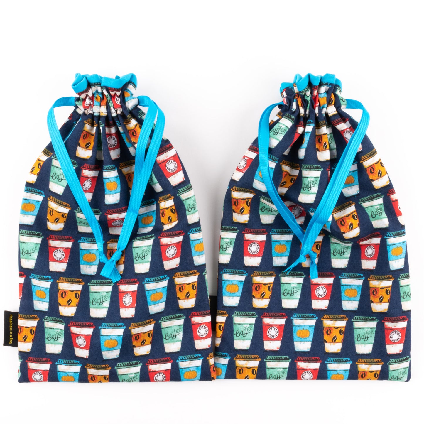 Travel shoe bags made from fabric with colorful prints of to-go coffee cups