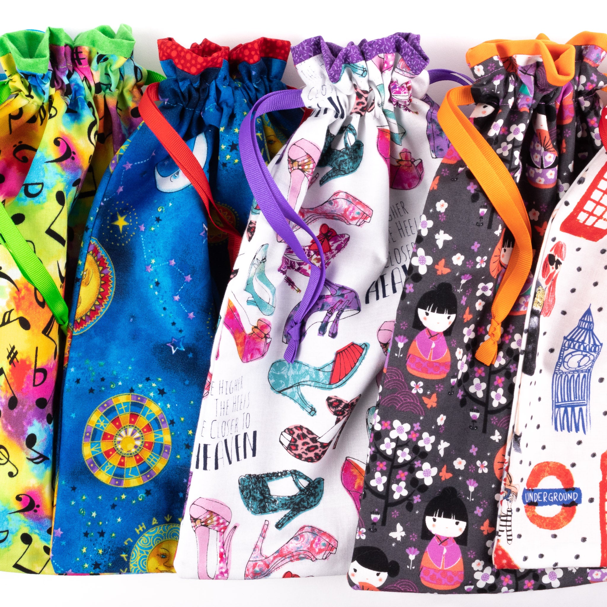 Row of colorful draw-string fabric shoe bags