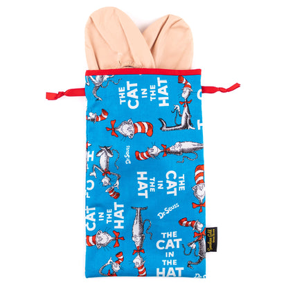 A pair of pink flat-soled ballet dance slippers peeking from a "Cat in the Hat" themed shoe bag