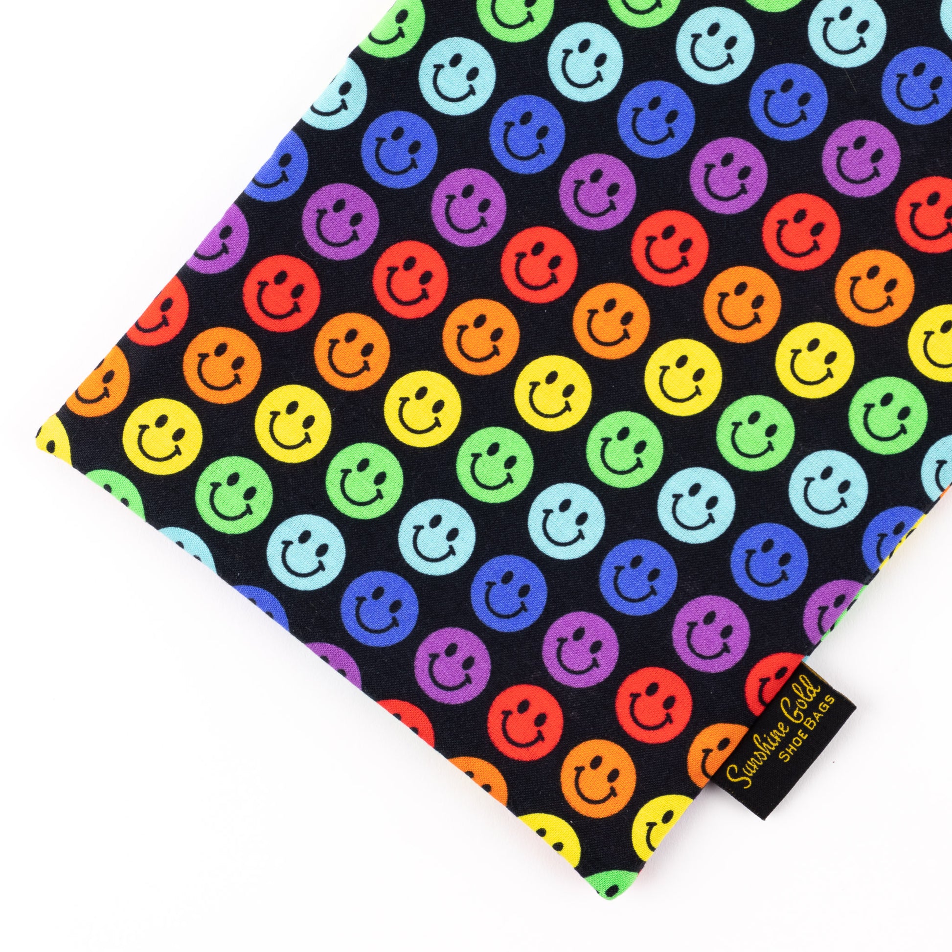 Close up of multi-color smiles-themed fabric shoe bag