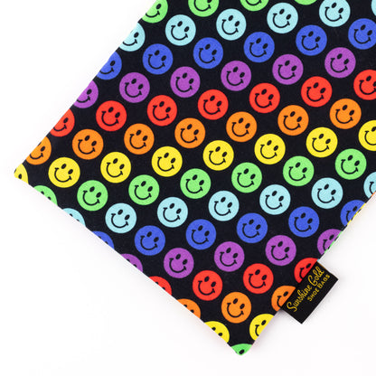 Close up of multi-color smiles-themed fabric shoe bag