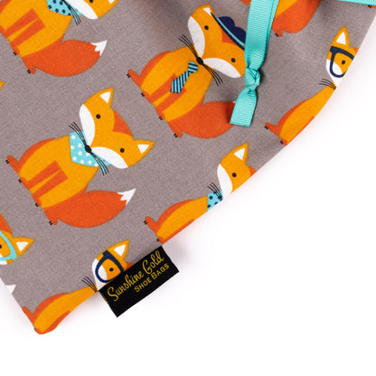 Close-up view of orange foxes fabric shoe bag