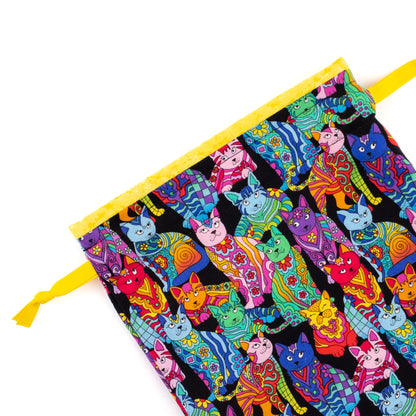 Close-up of shoe bag showing details of the colorful cats-themed fabric