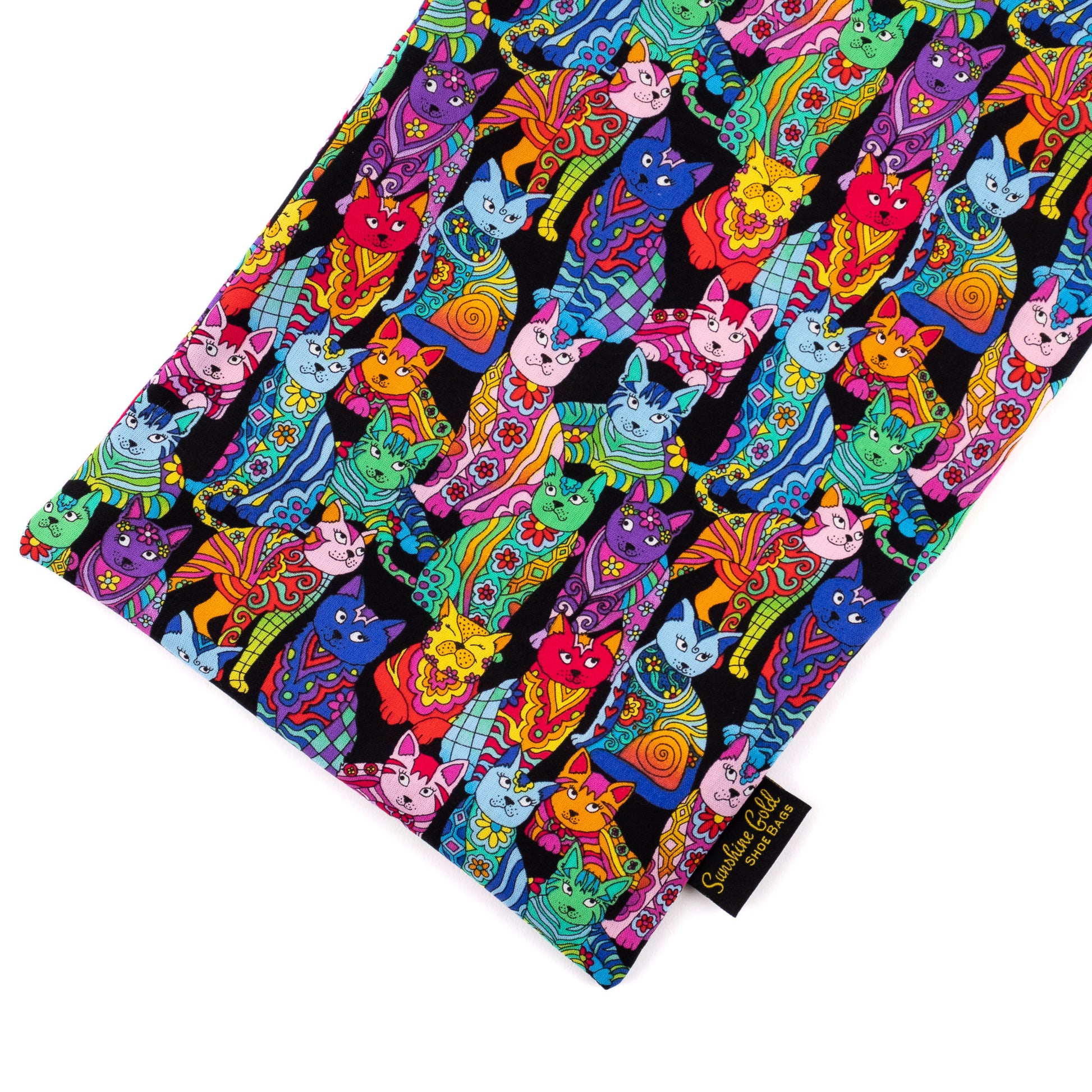 Close-up of shoe bag showing graphics of vibrant multicolored cat-themed fabric