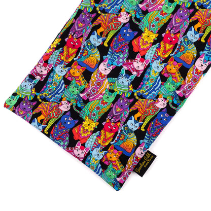 Close-up of shoe bag showing graphics of vibrant multicolored cat-themed fabric