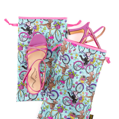 Fabric shoe bags set of 2 in light teal, pink, purple, and yellow, with pink lining