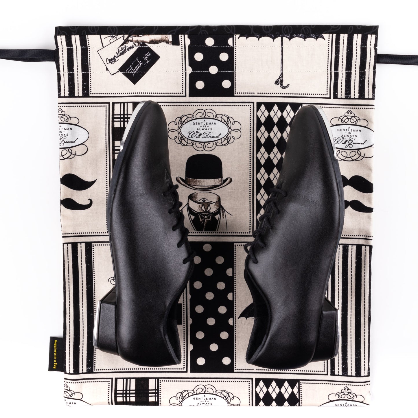 Men's dance shoe bag in black and beige fabric with drawings of mustaches, umbrellas, and top hats