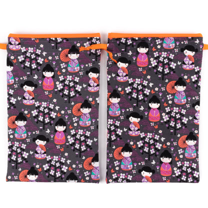 Set of two travel shoe bags with Japanese kokeshi doll design